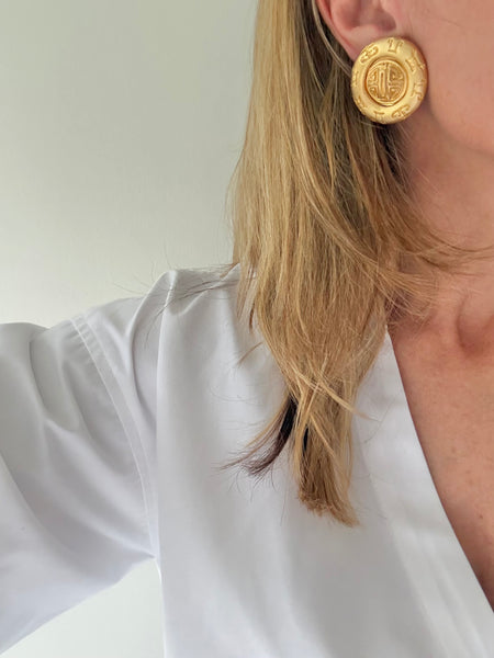 Matte Gold Zodiac Disk Clip On Earrings
